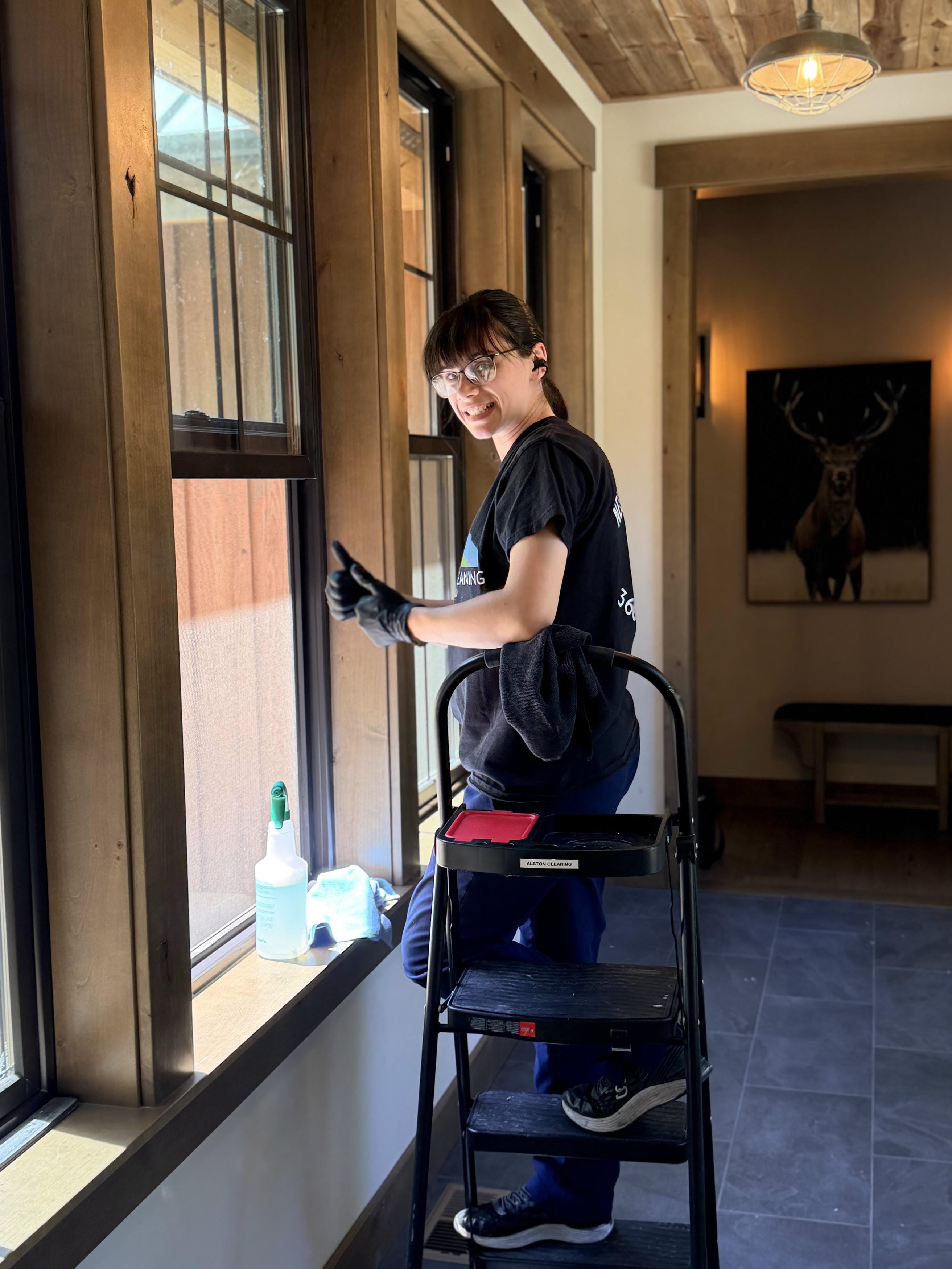 Happy Alston Cleaning technician after interior window cleaning